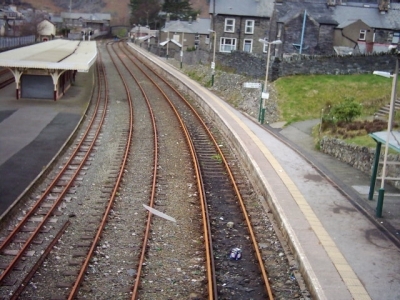 narrow guage and normal guage tracks running through the small station at blaenau